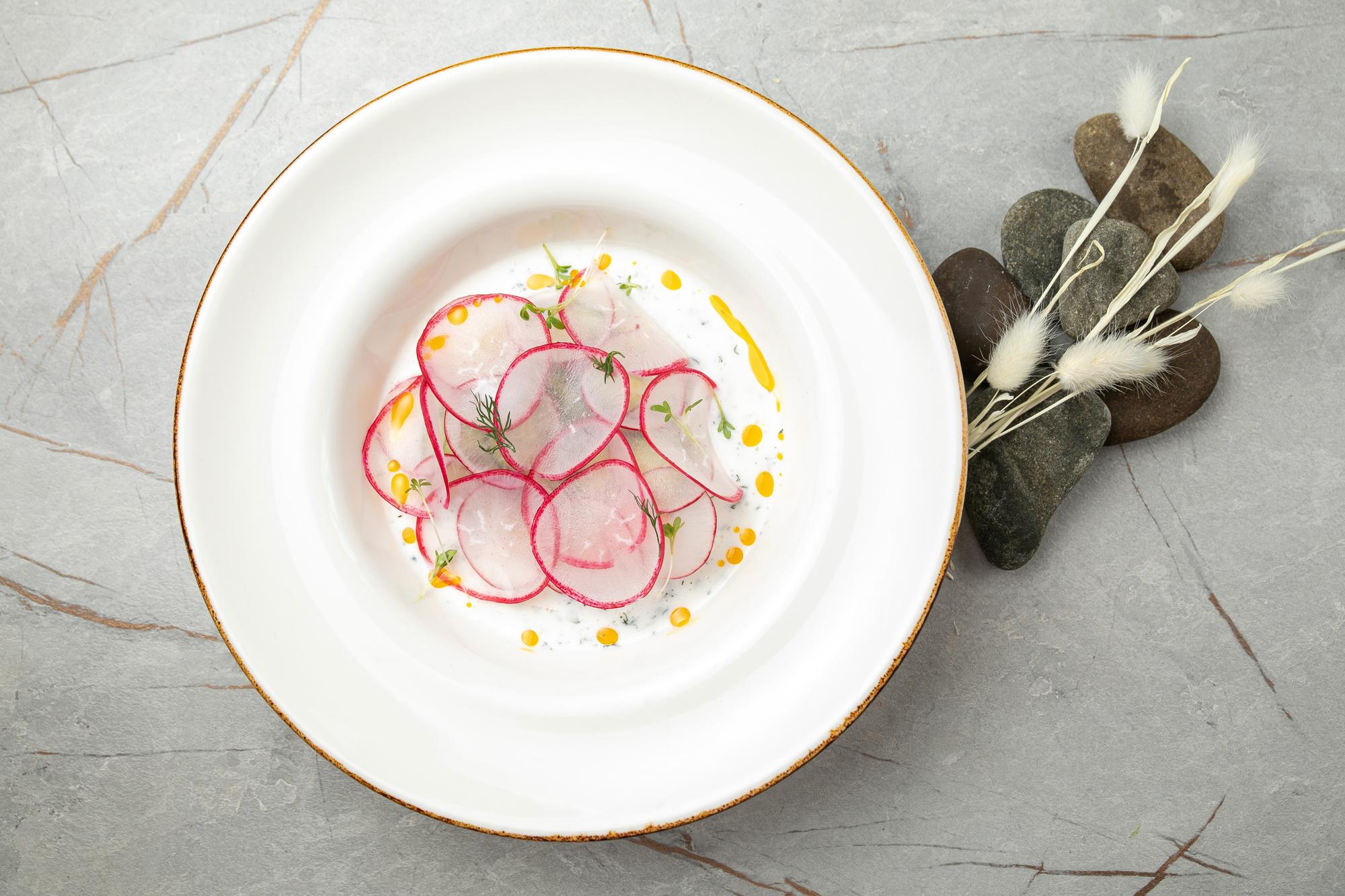 Plated tasting menu on pastel plates