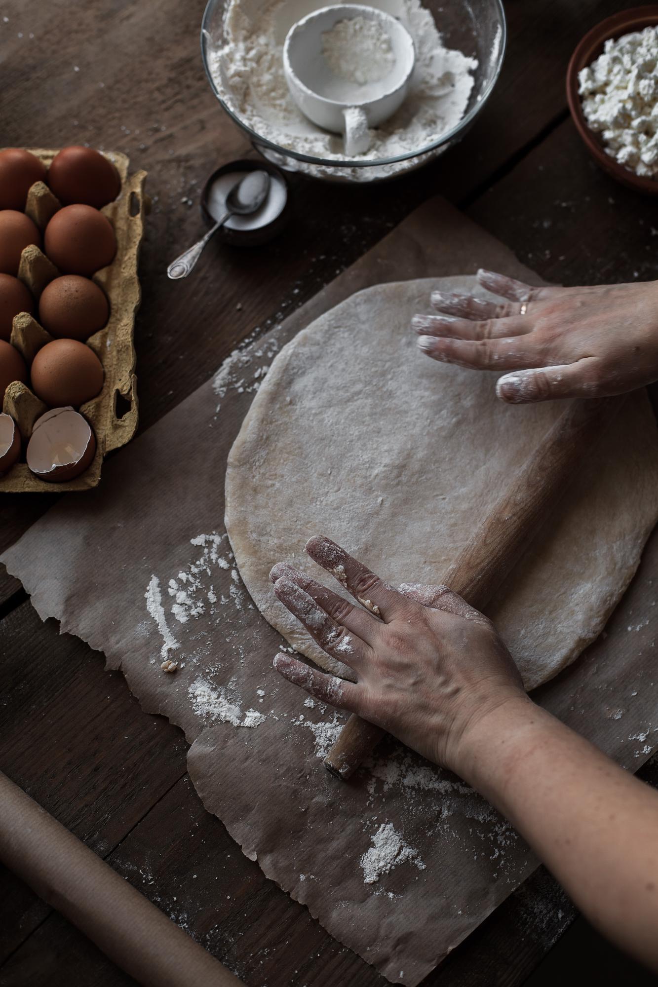 Close-up of hands kneading dough